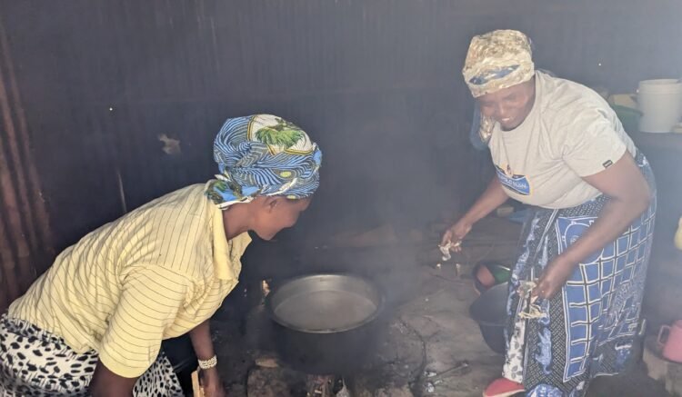 Cooking using a typical 3 stone fire Nakuru
